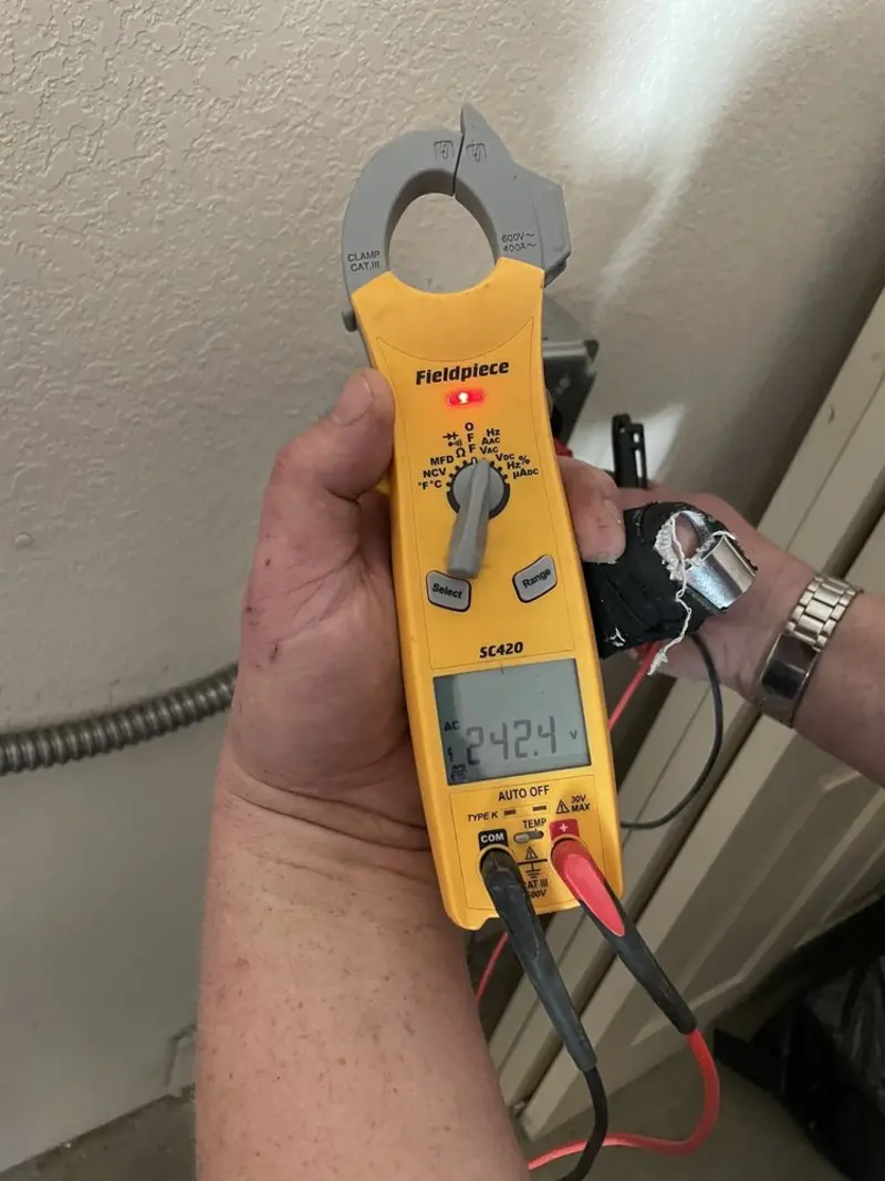 Voltage testing with clamp meter during Outlet Installation in Yankton